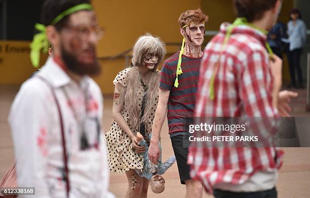 This photo taken on September 17, 2016 shows Katerina Halkeas playing a zombie witch in "Zedtown", a real-life adventure event based on a video game...