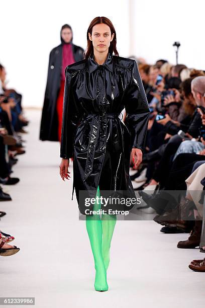 Model walks the runway during the Balenciaga designed by Demma Gvasalia show as part of the Paris Fashion Week Womenswear Spring/Summer 2017 on...