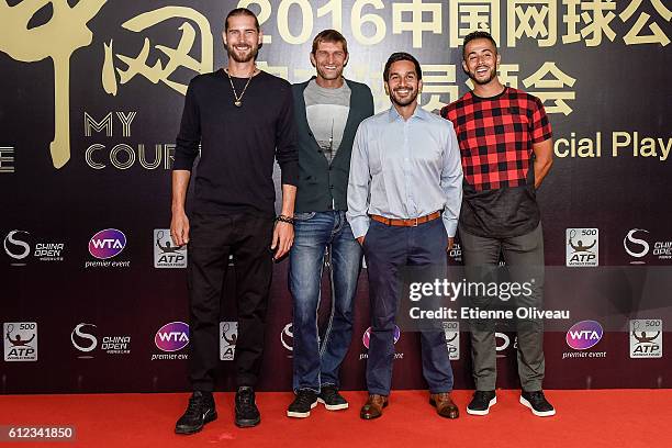 Max Mirnyi and his coach with Treat Huey of Phillipines and his coach of Belarus arrive at the 2016 China Open Player Party at The Birds Nest, on...