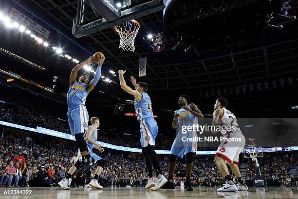 Jarnell Stokes of the Denver Nuggets grabs the rebound against the Toronto Raptors on October 3, 2016 at the Scotiabank Saddledome in Calagary,...