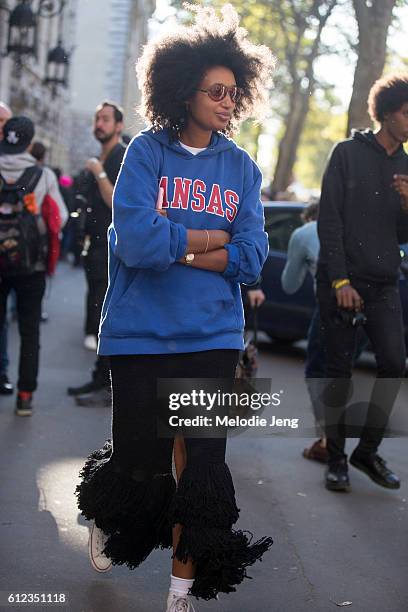 Julia Sarr-Jamois wears a "Kansas" sweatshirt outside the Hermes show on October 3, 2016 in Paris, France.