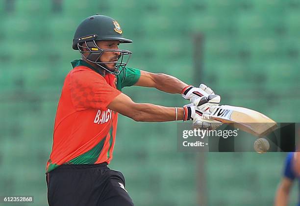 Cricketer Nasir Hossain plays a shot during the warm-up cricket match between England and Bangladesh Cricket Board XI at Khan Shaheb Osman Ali...