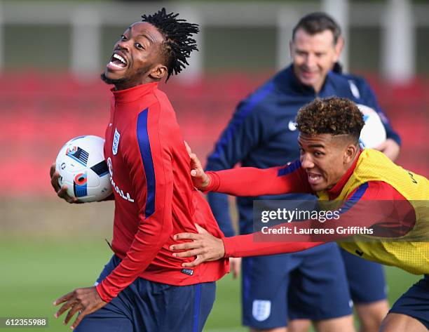 Nathaniel Chalobah and Nathan Holgate of England U-21 are all smiles during a training session at St Georges Park on October 4, 2016 in...