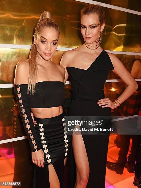Jasmine Sanders and Karlie Kloss attend the L'Oreal Paris Gold Obsession Party at Hotel de la Monnaie on October 2, 2016 in Paris, France.
