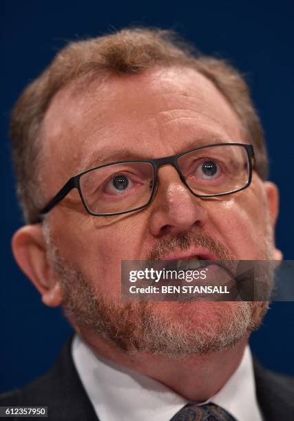 British Scotland Secretary David Mundell delivers a keynote address on the third day of the annual Conservative Party conference at the International...