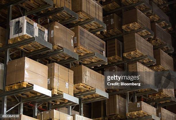 Packaged goods sit on pallets on high shelving in a storage aisle at the Ikea AB distribution center in Yesipovo village, near Moscow, on Monday,...