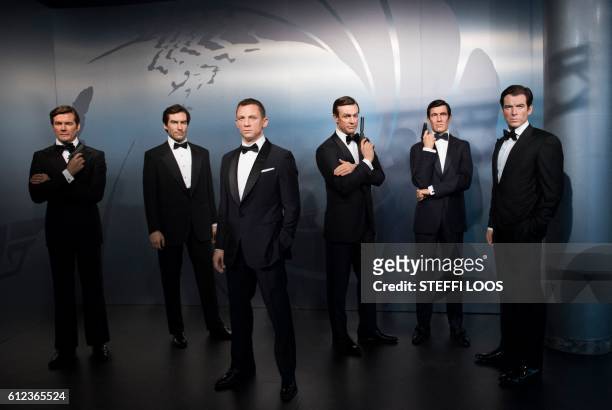 Wax figures of James Bond actors Roger Moore, Timothy Dalton, Daniel Craig, Sean Connery, George Lazenby and Pierce Brosnan are presented at the...