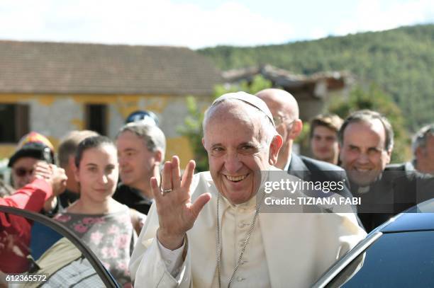 Pope Francis waves as he arrives in Accumoli on October 4 after an earthquake hit the area on August 24, a disaster that claimed nearly 300 lives. -...