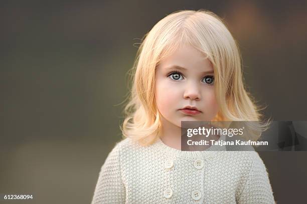 candid portrait of a blonde toddler girl - bavaria girl stock pictures, royalty-free photos & images