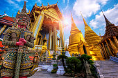 Travel concept, Giant statue at Temple Wat Pra Kaew