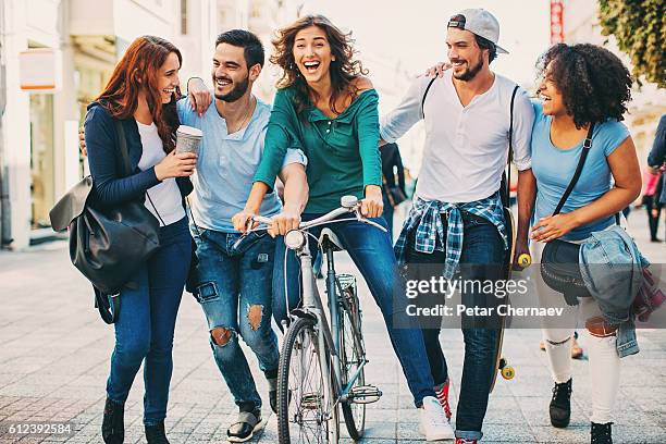 carefree and happy young people - live in levis event stock pictures, royalty-free photos & images