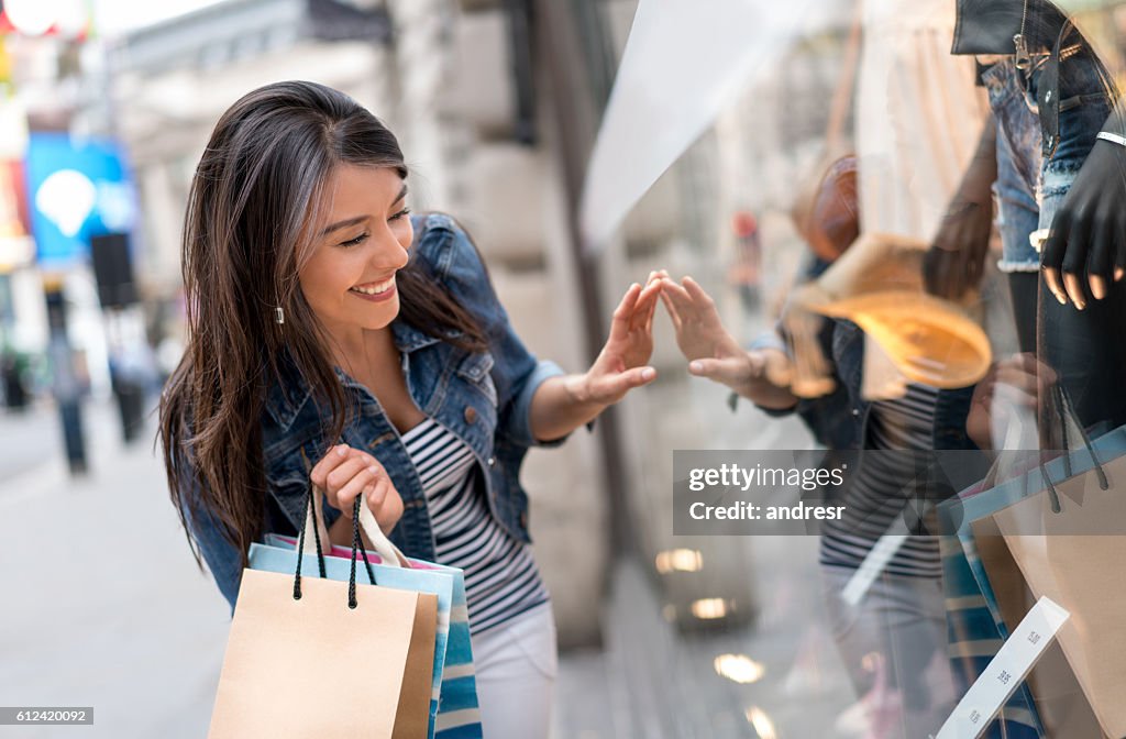 Shopping woman looking at a window