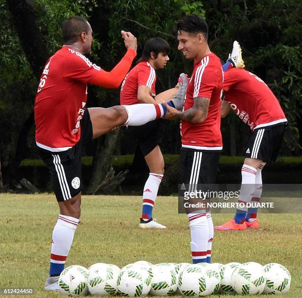 Paraguay's players Paulo Da Silva and Hernan Perez take part in a training session of the national football team at the Albiroga training centre in...