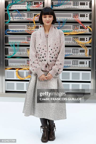 Chinese actress and model Angela Yuen poses before the Chanel 2017 Spring/Summer ready-to-wear collection fashion show, on October 4, 2016 in Paris....