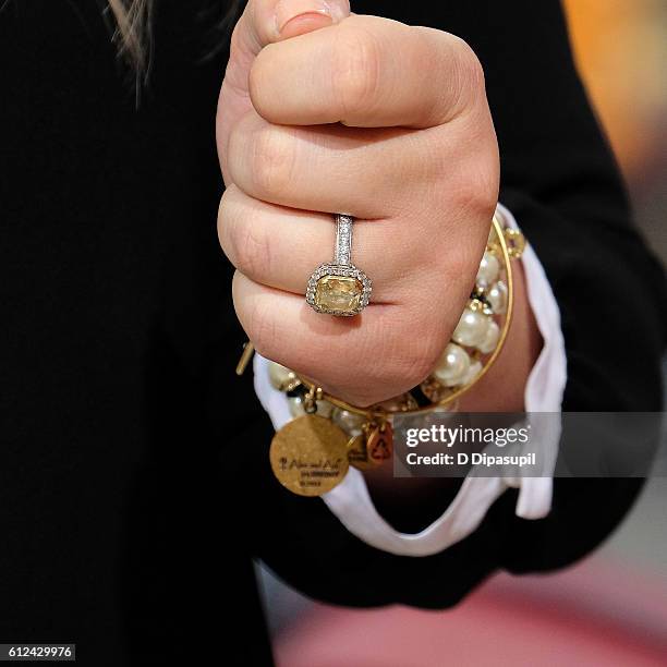 Kelly Clarkson, ring detail, visits "Extra" at their New York studios at H&M in Times Square on October 4, 2016 in New York City.