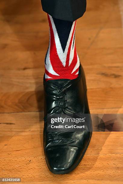 Delegate wears Union flag socks as he attends the third day of the Conservative Party Conference 2016 at the International Conference Centre on...