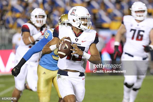 Anu Solomon of the Arizona Wildcats scrambles to avoid the sack during the game against the UCLA Bruins at Rose Bowl on October 1, 2016 in Pasadena,...