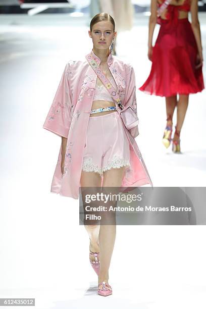 Model walks the runway during the Shiatzy Chen show as part of the Paris Fashion Week Womenswear Spring/Summer 2017 on October 4, 2016 in Paris,...