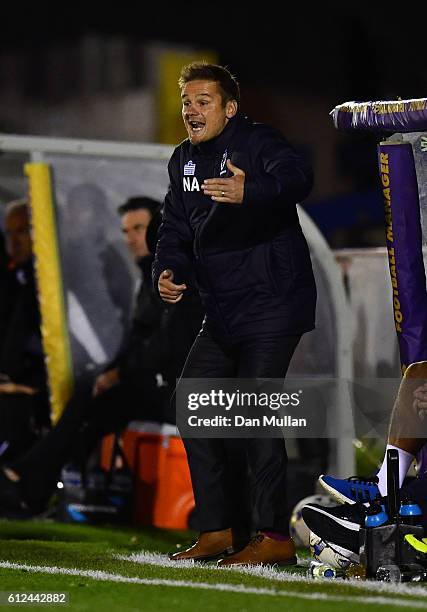 Neal Ardley, Manager of AFC Wimbledon reacts during the EFL Checkatrade Trophy match between AFC Wimbledon and Plymouth Argyle at The Cherry Red...