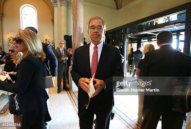 Chairman of the Augusta National Golf Club, Billy Payne walks into Saint Vincent Basilica during a Celebration of Arnold Palmer at Saint Vincent...