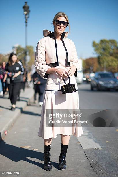 Sofie Valkiers poses wearing Chanel after the Chanel show at the Grand Palais during Paris Fashion Week SS17 on October 4, 2016 in Paris, France.