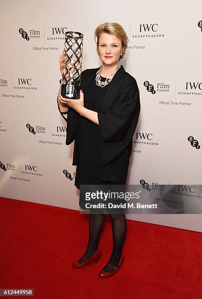 Hope Dickson-Leach, winner of the Bursary Award in association with IWC Schaffhausen, poses with her award at the IWC Schaffhausen Dinner in Honour...