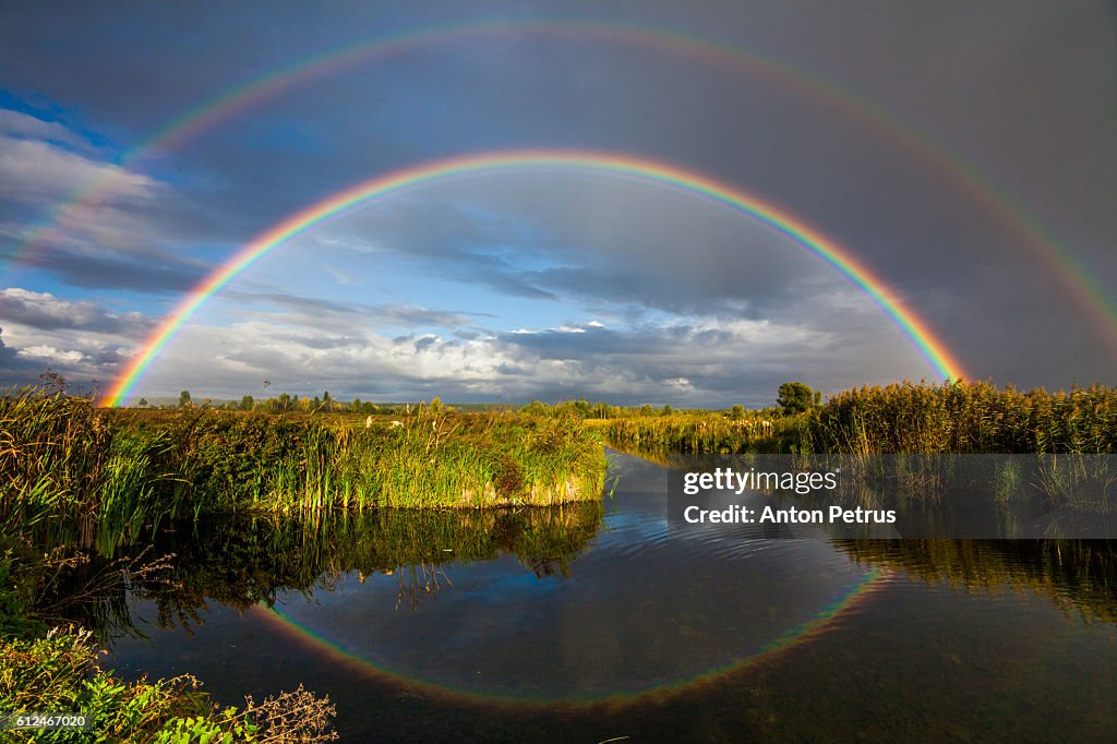 Double rainbow over the river