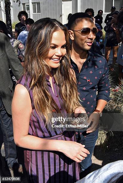 Model and television personality Chrissy Teigen and singer/songwriter John Legend campaign for Democratic presidential nominee Hillary Clinton as...