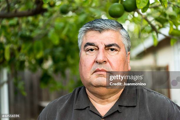 mature hispanic man - fat mexican man stock pictures, royalty-free photos & images