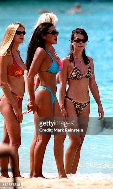 Dressed in bikinis, unidentified 'Baywatch Hawaii' extras walk on the television series' set, Honolulu, Hawaii, July 20, 1999.