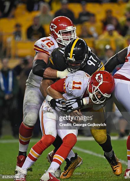 Defensive lineman Cameron Heyward of the Pittsburgh Steelers sacks quarterback Alex Smith of the Kansas City Chiefs as offense lineman Eric Fisher...