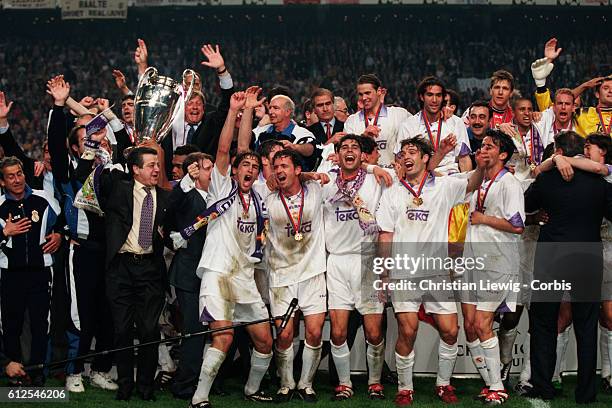 Real Madrid's players celebrate with the trophy after they won the 1998 UEFA Champions League final against Juventus 1-0.