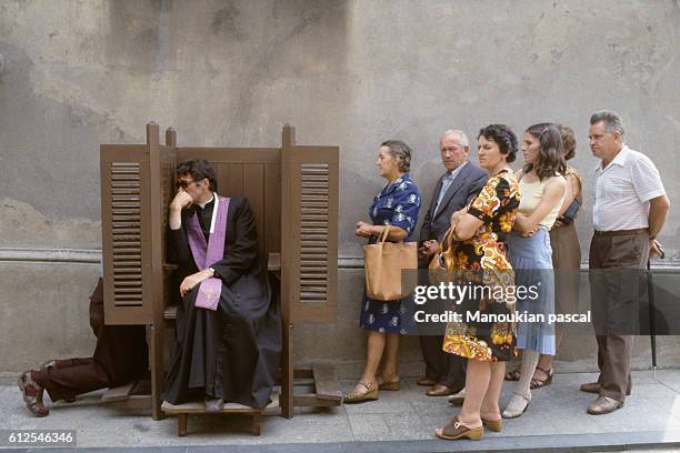 Street confessional. Each year, many Christians come to Czestochowa on Assumption Day to see the Black Madonna painting, a shrine to the Virgin Mary,...