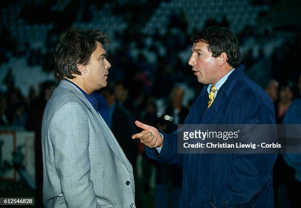 Bernard Tapie, president of Olympique de Marseille and Roland Courbis, coach of Bordeaux, chat during a French championshipsocer match Marseille vs...
