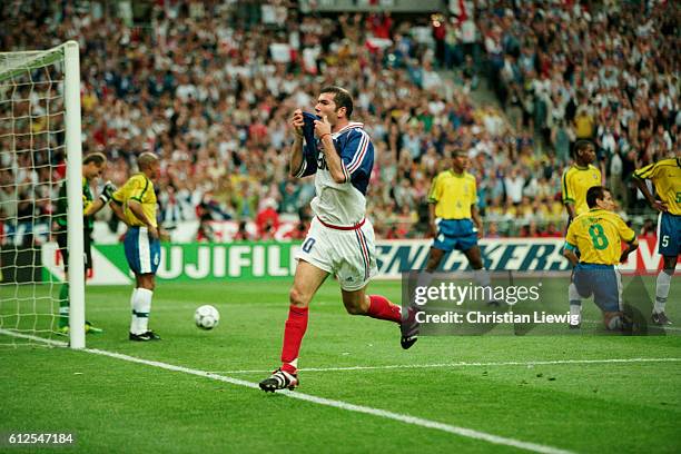 France's Zinedine Zidane celebrates scoring the second goal of the 1998 FIFA World Cup final against Brazil. France won 3-0. | Location: Saint Denis,...