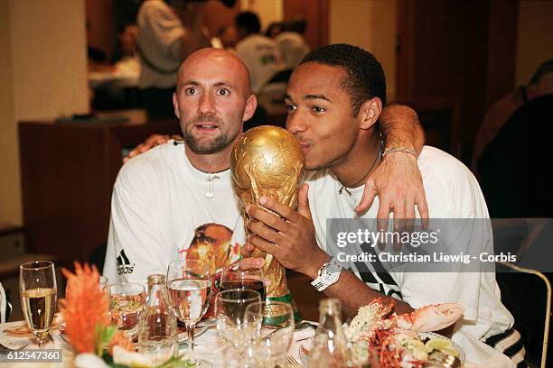 France's players are received at the French soccer federation after their 3-0 victory over Brazil in the final of the 1998 FIFA World Cup. With the...