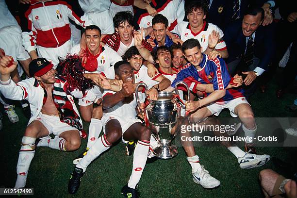 Milan's players celebrate with trophy after they won the 1994 UEFA Champions League final against FC Barcelona 4-0.