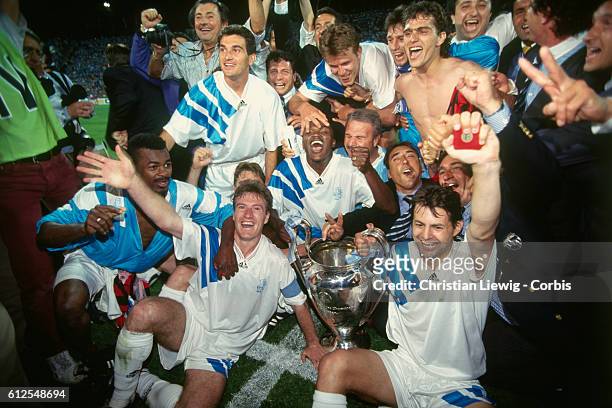 Champions League Final, Olympique de Marseille vs AC Milan. Marseille won 1-0. Marseille's players celebrate victory with the trophy.