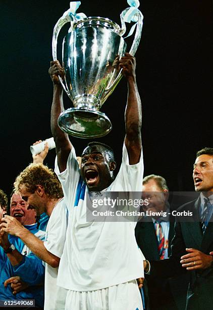Champions League Final, Olympique de Marseille vs AC Milan. Marseille won 1-0. Marseille's striker Basile Boli holding the trophy.