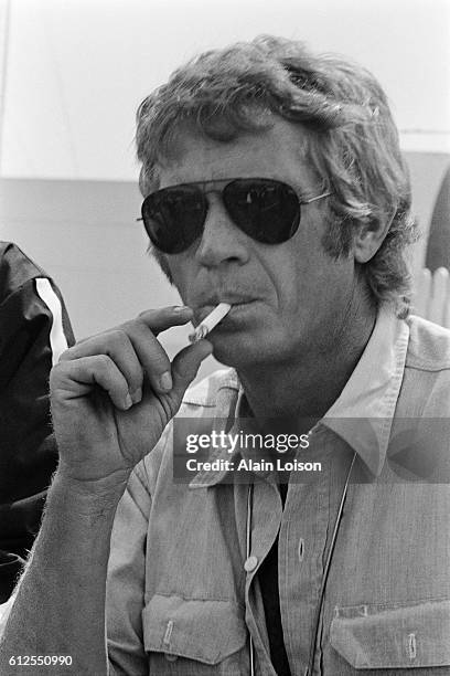 American actor and racer Steve McQueen, nicknamed "The King of Cool", attends the 1969 24 Hours of Le Mans.