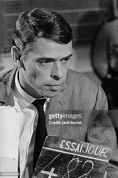 Belgian singer Jacques Brel on the set of the film Les Risques du Metier , directed by Andre Cayatte.