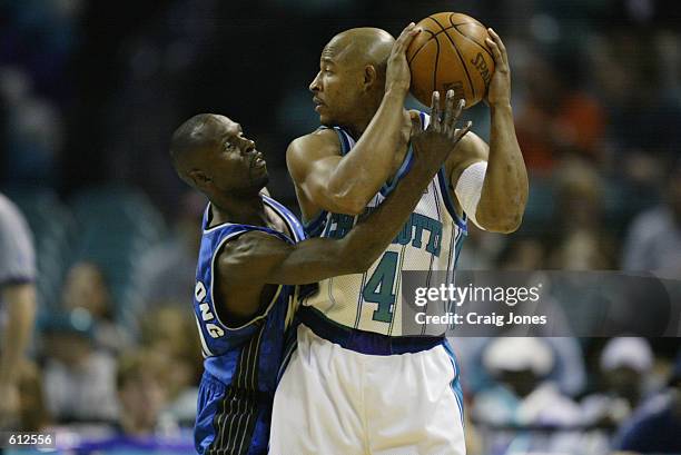 Guard David Wesley of the Charlotte Hornets faces up point guard Darrell Armstrong of the Orlando Magic during game two of the Eastern Conference...