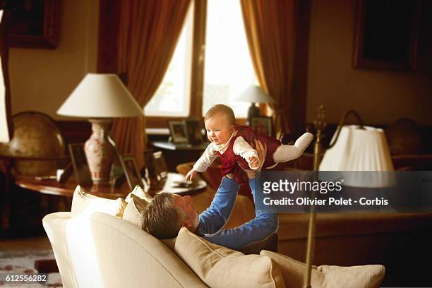 Prince Philippe of Belgium shares a moment with Princess Eleonore in the lounge of their winter apartment.