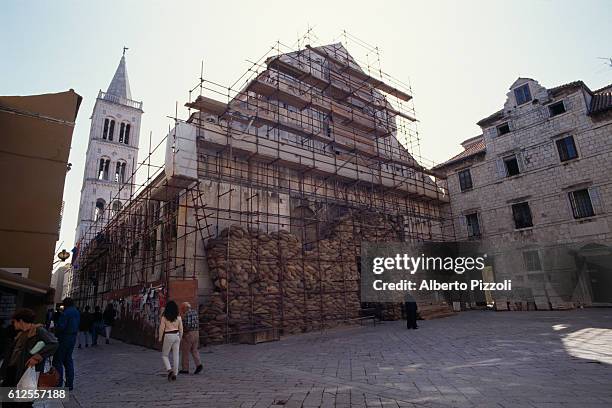 Sandbags protect a church from bombardments and combat in the Croatian city of Zadar.