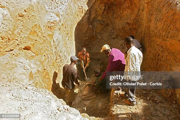 Workers looking for heterogenite in holes of a mine located next to Lubumbashi. In 2004, job cuts, which were part of a restructuring plan sponsored...