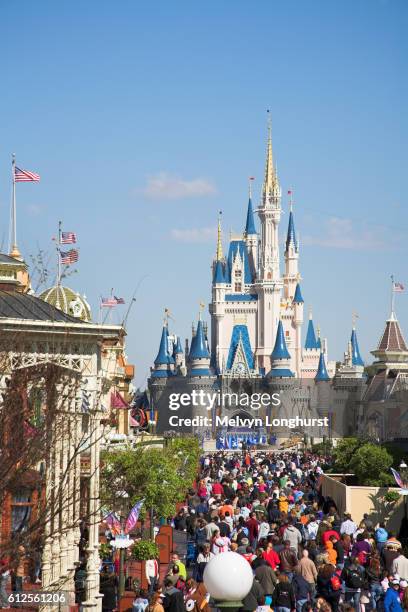 view along main street to cinderella castle, magic kingdom, orlando, florida, usa - orlando florida family stock pictures, royalty-free photos & images