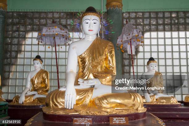 buddha statues at shwedagon pagoda, yangon, (rangoon), myanmar, (burma) - rangun stock pictures, royalty-free photos & images