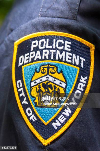 new york police department badge on policeman's shirt, nypd, manhattan, new york city, new york, usa - new york city police department stock pictures, royalty-free photos & images
