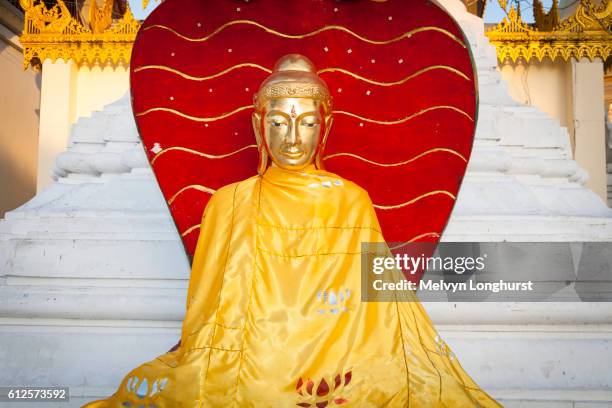 a colourful buddha statue at shwedagon pagoda, yangon, (rangoon), myanmar, (burma) - rangun stock pictures, royalty-free photos & images