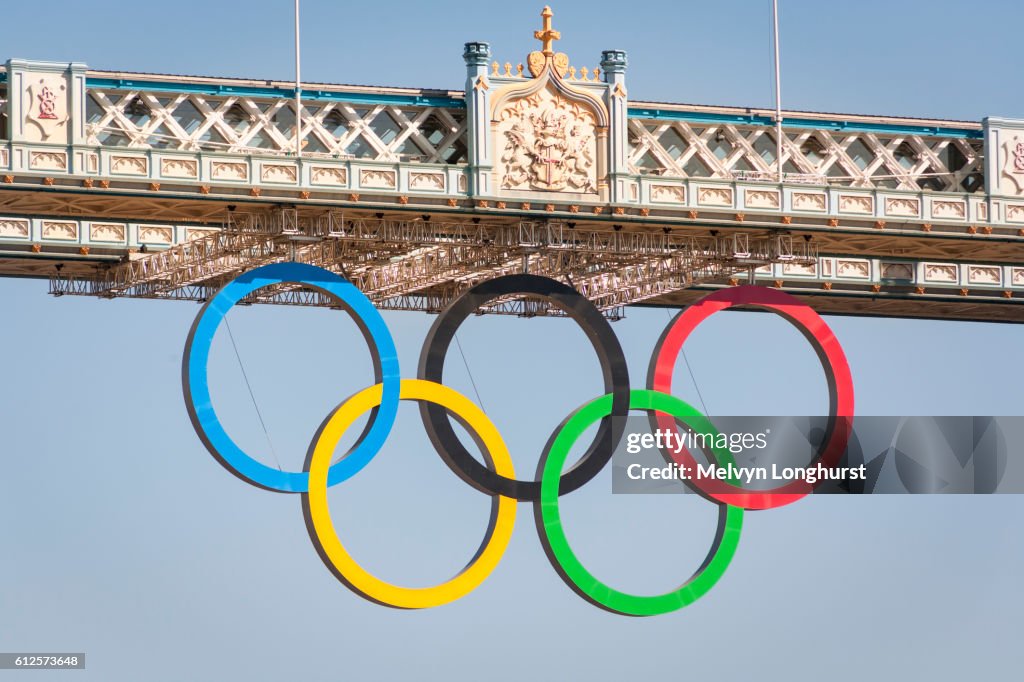The Olympic rings, celebrating the 2012 Olympic Games, suspended from Tower Bridge, London, England